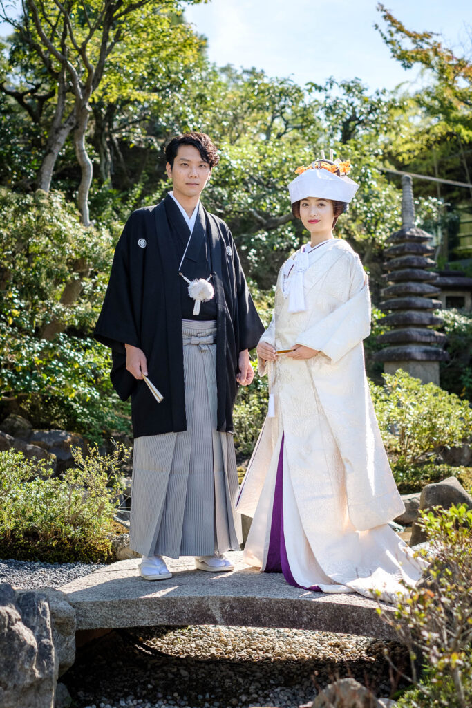 京都の料亭「京大和」の結婚式で、白無垢角隠し姿の新婦様と、紋付袴姿の新郎様